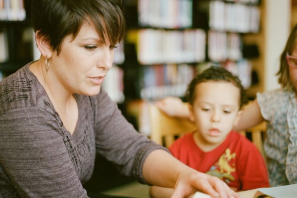 teacher showing example of classroom management plan to a child